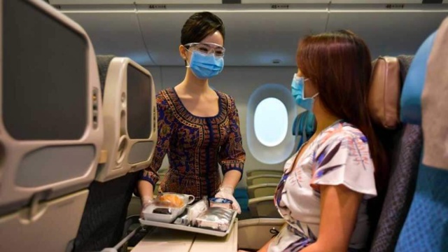 singapore airlines stewardess and passengers